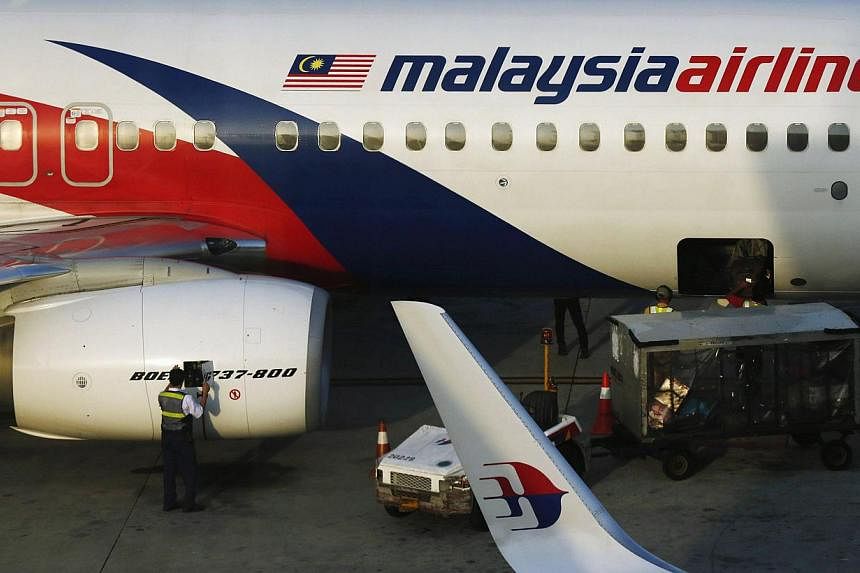 Minority shareholders in Malaysian Airline System Bhd (MAS) on Thursday backed a RM1.4 billion (S$542.6 million) bid by its majority owner, state fund Khazanah Nasional Bhd, to take the struggling carrier private. -- PHOTO: REUTERS