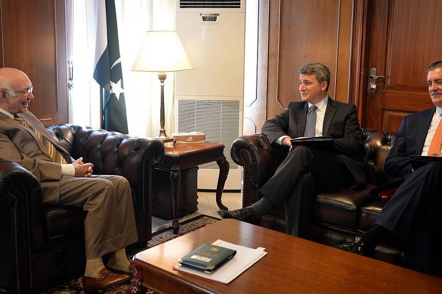 US Ambassador to Pakistan Richard Olson (far right) looks on at a meeting in Isdlamabad on Oct 28 between&nbsp;Pakistan's Adviser for National Security and Foreign Affairs Sartaj Aziz (left) and US Special Representative for Afghanistan and Pakistan 