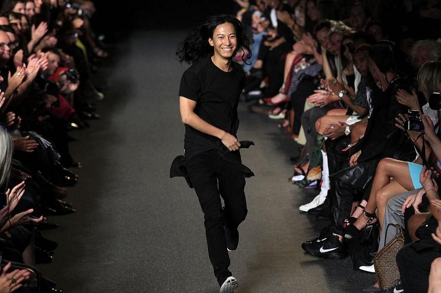 Alexander Wang acknowledges the crowd during his Spring/Summer 2015 collection at New York Fashion Week on Sept 6, 2014, in New York. -- PHOTO: AFP