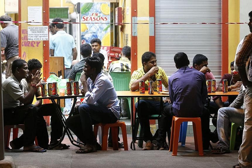 People drinking beer at a shop in Little India. The majority of people polled by the Ministry of Home Affairs (MHA) are strongly supporting proposals to restrict the consumption of alcohol in public. -- PHOTO: ST FILE&nbsp;