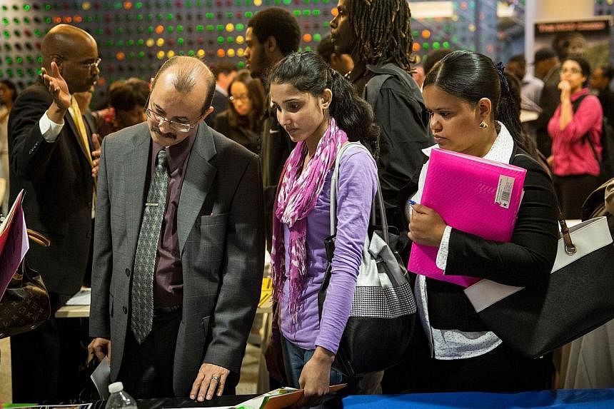 People attend a jobs fair at the Bronx Public Library on Sept 17, 2014, in the Bronx Borough of New York City.&nbsp;&nbsp;Unemployment and rising income inequality will top concerns for global leaders in 2015, a World Economic Forum (WEF) study said 