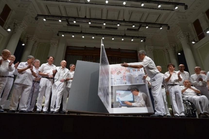 People's Action Party (PAP) members at the celebration of the PAP's 60th anniversary at Victoria Concert Hall.&nbsp;To commemorate the event,&nbsp;Prime Minister Lee Hsien Loong launched the book PAP60: Foward Together, which chronicles 60 defining m