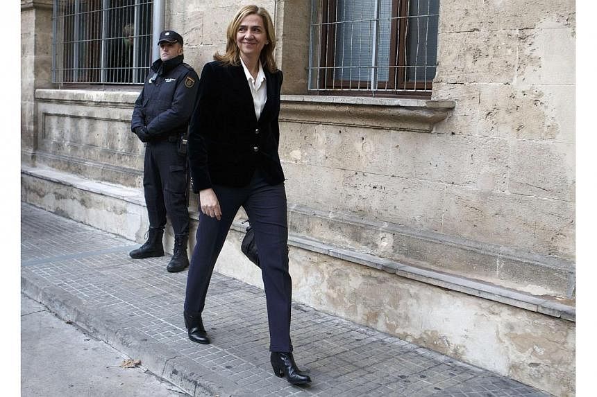 Spain's Princess Cristina, sister of King Felipe, arrives at a courthouse to testify before judge Jose Castro over tax fraud and money-laundering charges in Palma de Mallorca in this Feb 8, 2014, file photo.&nbsp;Spanish judges on Friday dismissed mo