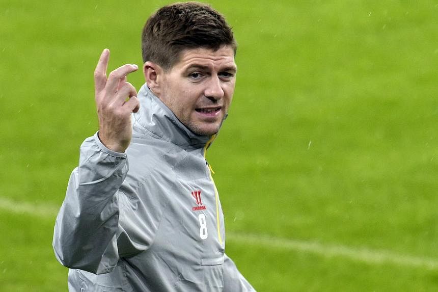Liverpool's English midfielder Steven Gerrard gestures during a training session at the Santiago Bernabeu stadium in Madrid on Nov 3, 2014 on the eve of the the UEFA Champions League Group football match Real Madrid versus Liverpool. Gerrard's untime