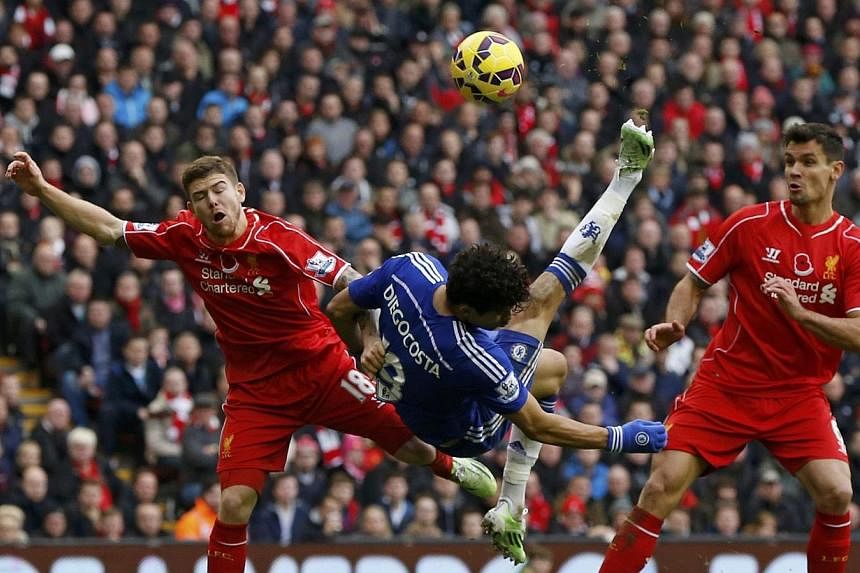 Chelsea's Diego Costa (centre) attempts an overhead kick during their English Premier League soccer match at Anfield in Liverpool, northern England on Nov 8, 2014.&nbsp;Diego Costa scored his 10th goal of the campaign, as English Premier League leade