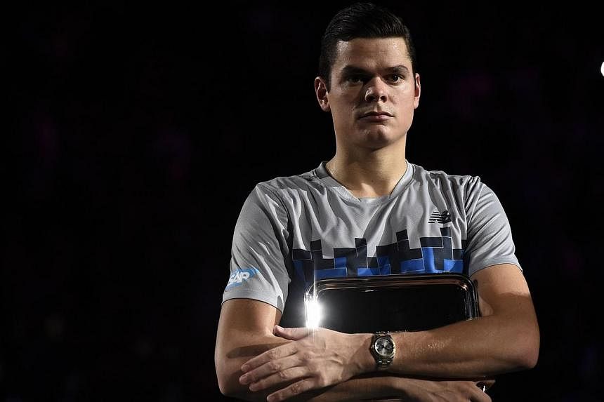 Canada's Milos Raonic poses with his trophy after his defeat against Serbia's Novak Djokovic during the final match at the ATP World Tour Masters 1000 indoor tennis tournament on Nov 2, 2014, at the Bercy Palais-Omnisport (POPB) in Paris. If proof we