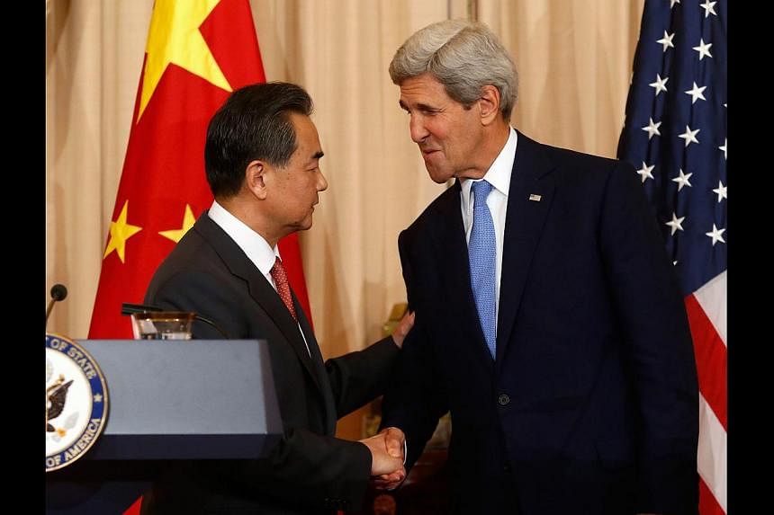 US Secretary of State John Kerry welcoming China's Foreign Minister Wang Yi at the State Department in Washington last month. US-China relations are the most important axis of East Asian international relations, affecting the entire region.