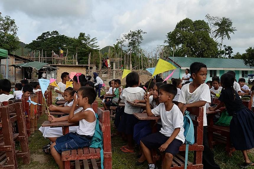 Pupils at a primary school in San Rafael village in Busuanga town, Palawan province. Haiyan flattened the school when it struck central Philippines on Nov 8 last year, but aid agencies, including Life! Community Development and Singapore Red Cross, h