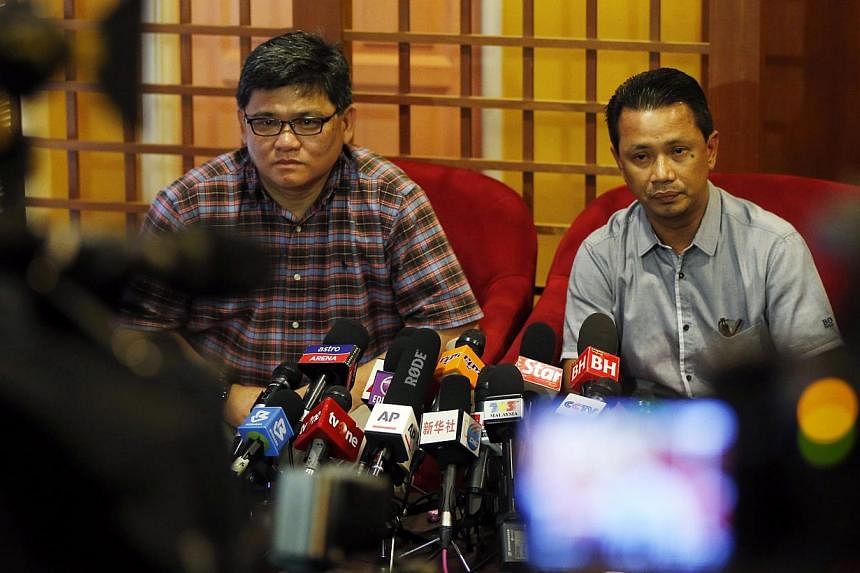 Badminton Association of Malaysia deputy president Norza Zakaria (right) speaks to the media during a news conference in Kuala Lumpur, Malaysia on Nov 8, 2014. -- PHOTO: REUTERS