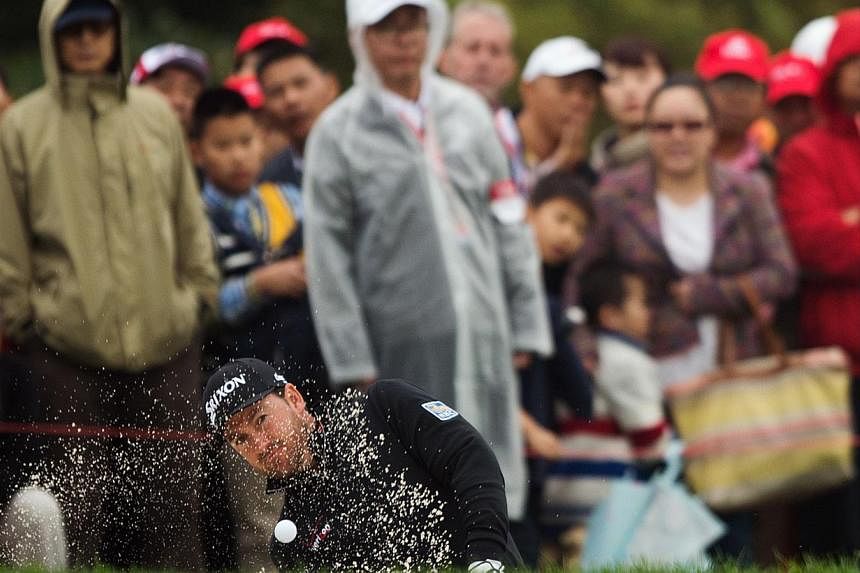 Graeme McDowell of Northern Ireland hits out of the bunker at the second hole during the third day of the WGC-HSBC Champions Golf tournament in Shanghai on Nov 8, 2014.&nbsp;McDowell lashed the snail-like pace of play on Saturday as "ridiculous" afte