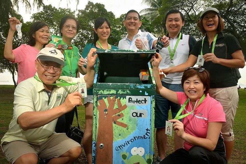 Keeping a lookout for litterbugs are volunteers (clockwise, from left) William Wan who is general secretary of the Singapore Kindness Movement, Rosalind Ng, Quek Ngor Koon, Michelle Tay, Liak Teng Lit (chairman of the Public Hygiene Council and head 