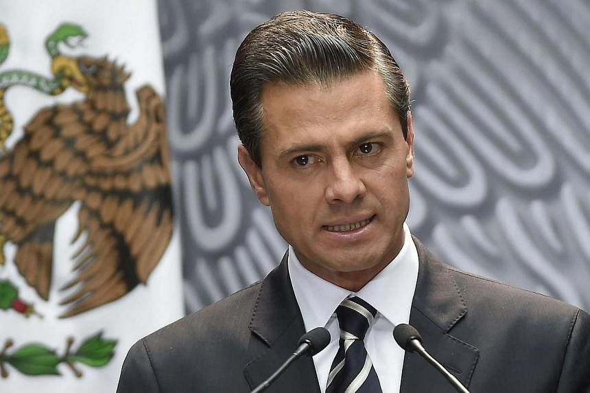 Mexican President Enrique Pena Nieto delivers a speech at the National Palace, in Mexico City, on Oct 6, 2014.&nbsp;Mexico's government defended on Friday its abrupt decision to scrap a bullet train deal it had just awarded to a Chinese-led consortiu