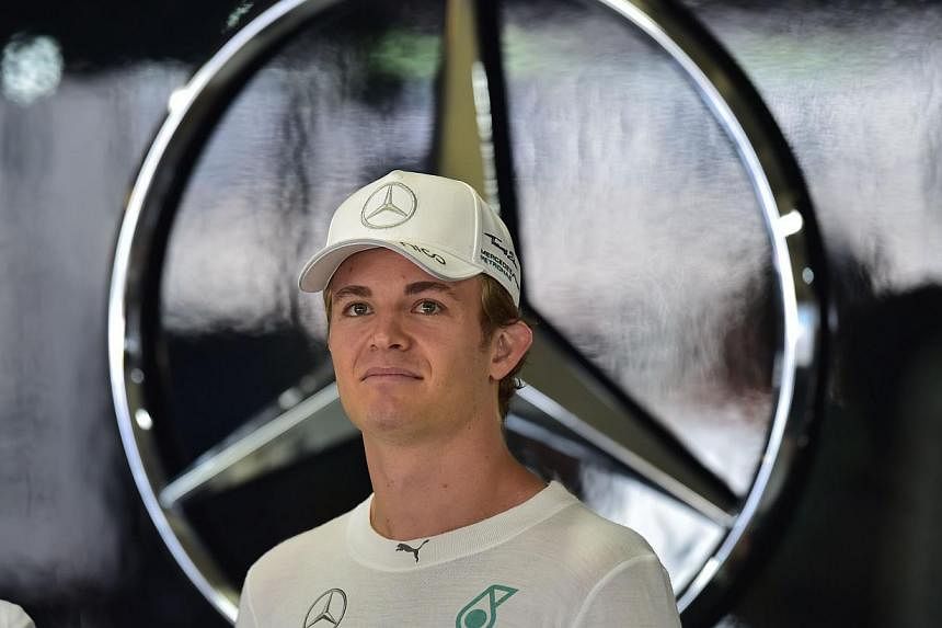 Mercedes' German driver Nico Rosberg stands by in the pits of the Interlagos racetrack in Sao Paulo, Brazil on Nov 7, 2014, two days ahead of the Brazil Formula One Grand Prix. Rosberg completed an encouraging "double" on Friday when he topped the ti