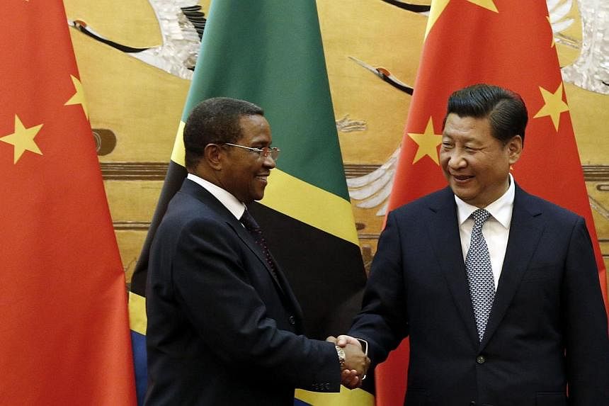 Tanzania's President Jakaya Kikwete (left) shaking hands with Chinese President Xi Jinping during a signing ceremony at the Great Hall of the People in Beijing on Oct 24, 2014. Tanzania on Friday denied allegations by a campaign group that Chinese of