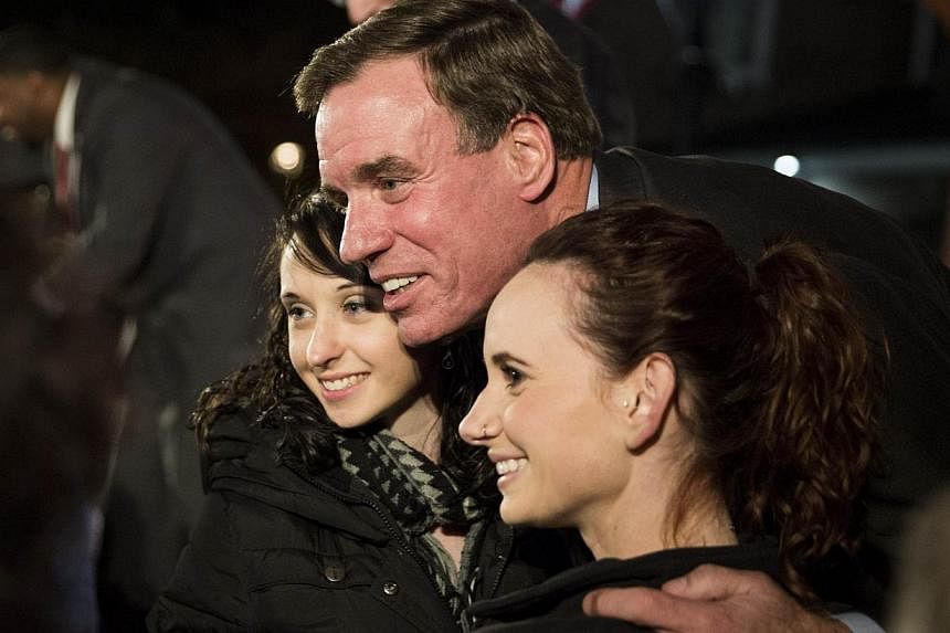US Senate Democrat Mark Warner (pictured above, on Nov 3, 2014 in Alexandria, Virginia&nbsp;with supporters) has won re-election, with his Republican rival conceding Friday after their unexpectedly tight race in Virginia. -- PHOTO: AFP