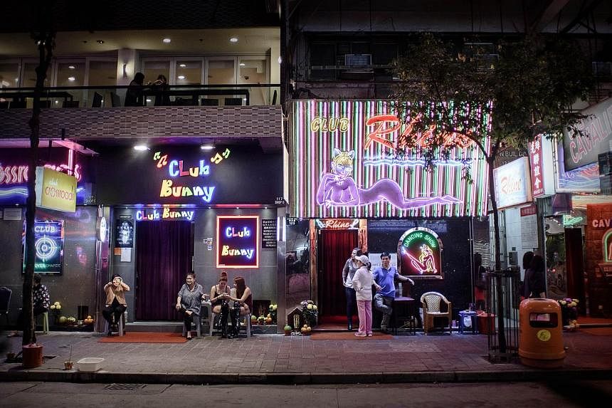 Bars in Hong Kong's Wanchai district. Once a den of vice and violence, a notorious playground for British and US sailors, Wanchai is now a thriving commercial district filled with offices and trendy restaurants. -- PHOTO: AFP&nbsp;