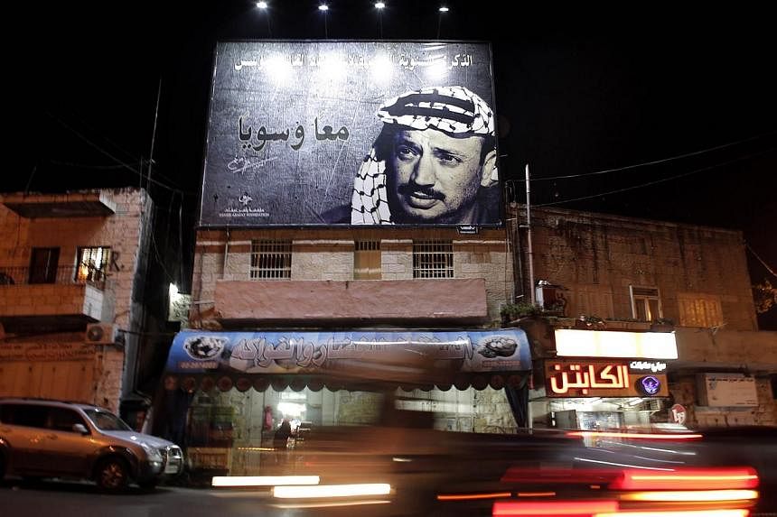 A picture taken on Nov 3, 2014, shows a giant portrait of late Palestinian leader Yasser Arafat displayed on a street in the Arab east Jerusalem neighbourhood of Beit Hanina.&nbsp;Palestinian president Mahmud Abbas' Fatah movement said on Sunday it i