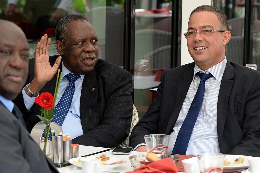 CAF president&nbsp;Issa Hayatou (2nd from left) speaks to Fouzi Lekjaa (right), president of the Moroccan Football Federation (FRMF), on Nov 3, 2014 in Rabat, Morocco, to discuss Morocco's request to postpone hosting the 2015 Africa Cup of Nations du