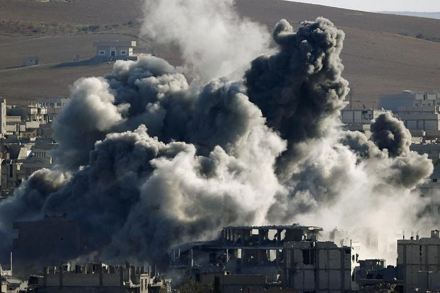 An explosion following an air strike is seen in central Kobane on Nov 9, 2014.&nbsp;More than 1,000 people, mostly extremists, have been killed in Kobane since the Islamic State in Iraq and Syria (ISIS) launched an offensive on the Syrian border town