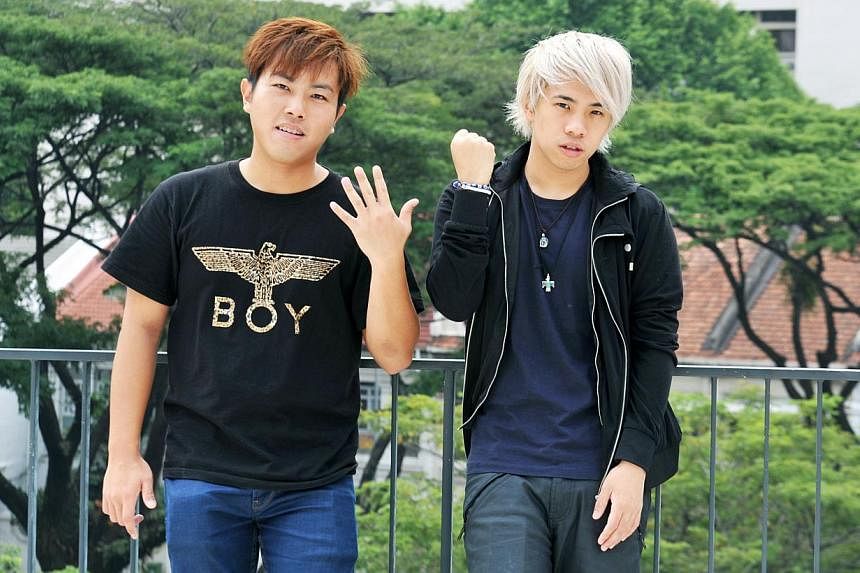Tan Jian Hao&nbsp;(right), a Singaporean YouTube star, on returning home after studying at an international school overseas. He will work with producer Shawn Tan (left) on the short film on Singlish. -- ST PHOTO: RUDY WONG