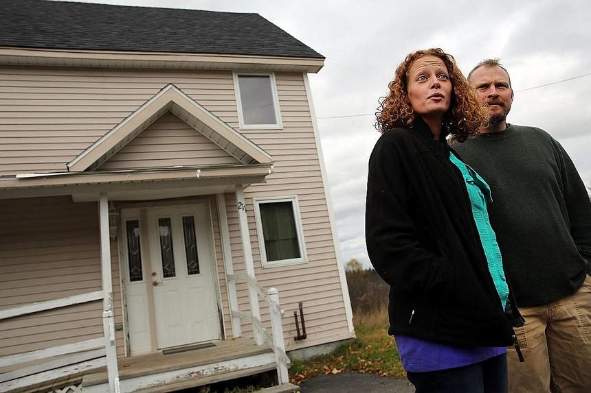 Kaci Hickox stands with her boyfriend Theodore Michael Wilbur as she gives a statement to the media in front of her home on Oct 31, 2014 in Fort Kent, Maine. -- PHOTO: AFP&nbsp;