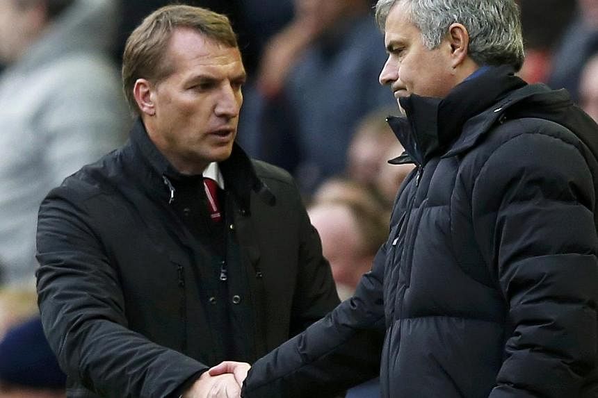 Chelsea manager Jose Mourinho (right) and Liverpool manager Brendan Rodgers shake hands at the end of their English Premier League soccer match at Anfield in Liverpool, northern England, Nov 8, 2014. -- PHOTO: REUTERS