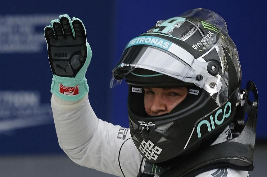 Mercedes Formula One driver Nico Rosberg of Germany waves after completing the qualifying session of the Brazilian Grand Prix in Sao Paulo Nov 8, 2014. Rosberg will start Sunday's Brazilian Grand Prix in Sao Paulo in pole position ahead of championsh
