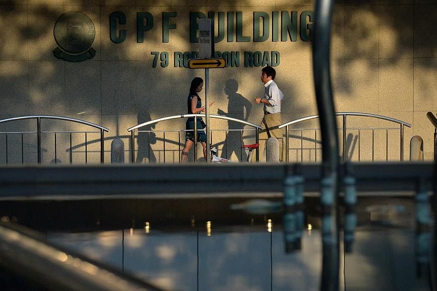People walking past the CPF Building logo at the foot of the building along Robinson Road.&nbsp;A series of focus group discussions will be held over the next few months to gather views from the public on how to enhance the Central Provident Fund (CP