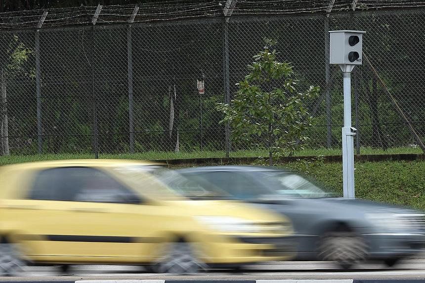 A digital red light camera installed at the junction of Woodlands Avenue 1 and Avenue 12. -- ST PHOTO:&nbsp;NEO XIAOBIN