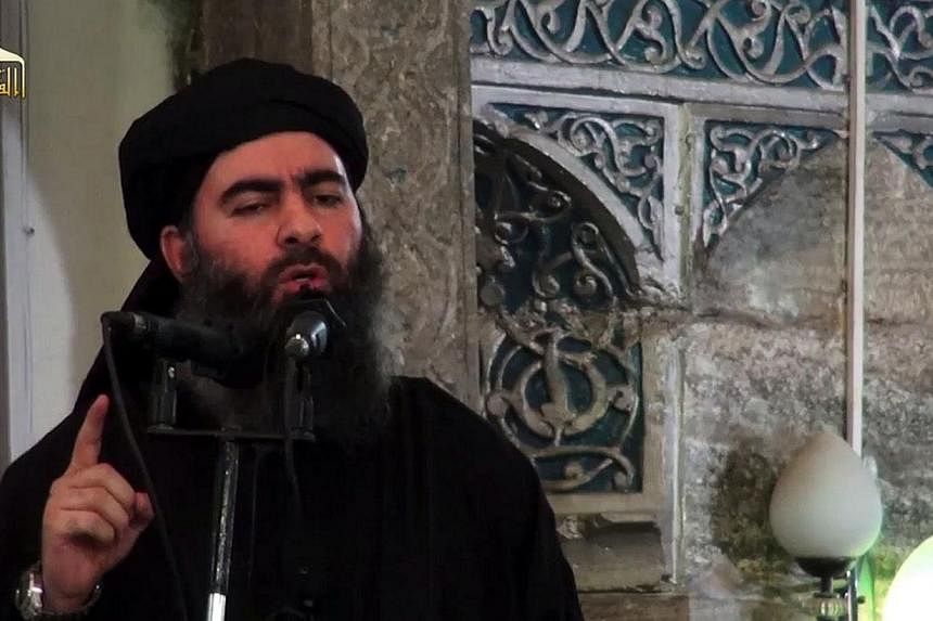 An aide to Islamic State leader Abu Bakr al-Baghdadi (pictured) has been killed in an air strike near the city of Falluja, Iraqi state television reported on Monday. -- PHOTO: AFP