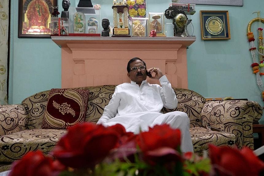 Indian Prime Minister Narendra Modi has appointed&nbsp;a yoga minister, Mr&nbsp;Shripad Yesso Naik, as part of a major revamp of his government after storming to power in May. -- PHOTO: AFP