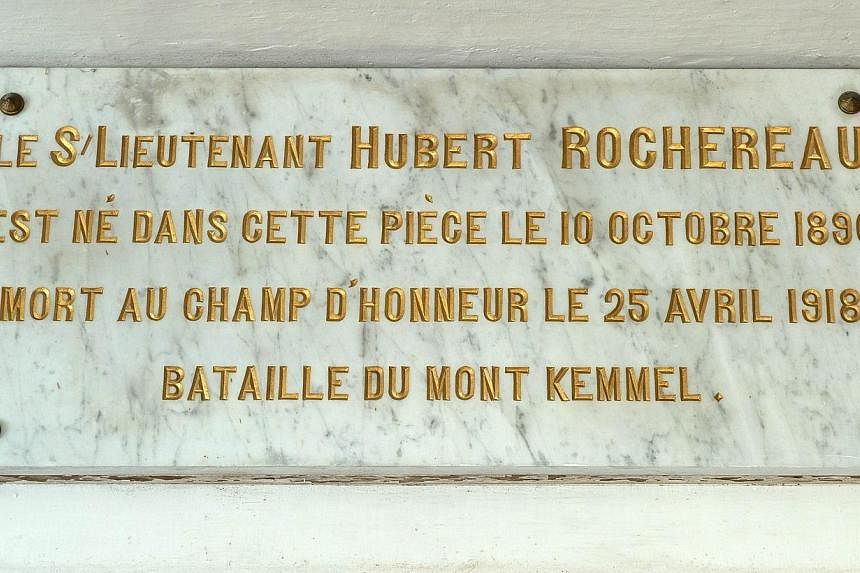 A picture taken on Oct 29, 2014 in Belabre, central France, shows a plaque reading "second lieutenant Hubert Rochereau was born in this room on Oct 10, 1896, died on the battlefield on April 25, 1918, Battle of Mount Kemmel" in the bedroom of French 