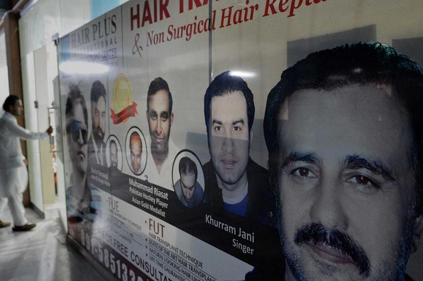 A hair transplant clinic in Peshawar. In the north-western city, home to underground Taleban hideouts and a gateway for trade to Afghanistan, men go about their business in the crowded dusty streets, their faces covered by bushy black beards that wou