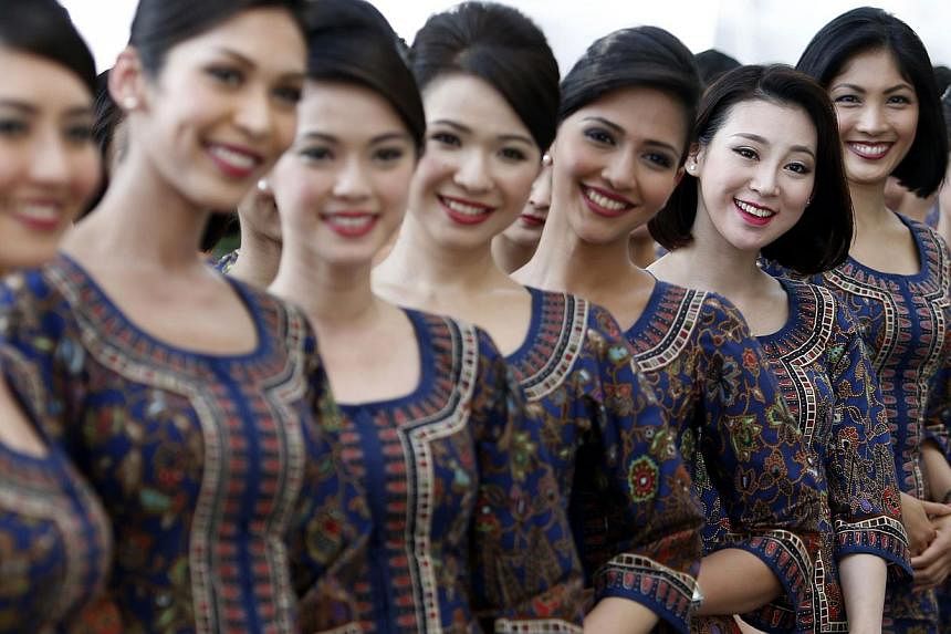 Singapore Airlines stewardesses. -- PHOTO: REUTERS