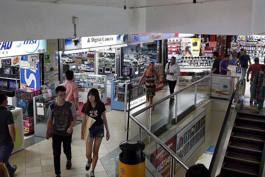 SMRT Ltd (Feedback), a satirical and online vigilante group, has gotten its Paypal account suspended after it had started to post personal details about the errant Sim Lim Square shopkeeper last week. -- ST PHOTO: LAU FOOK KONG