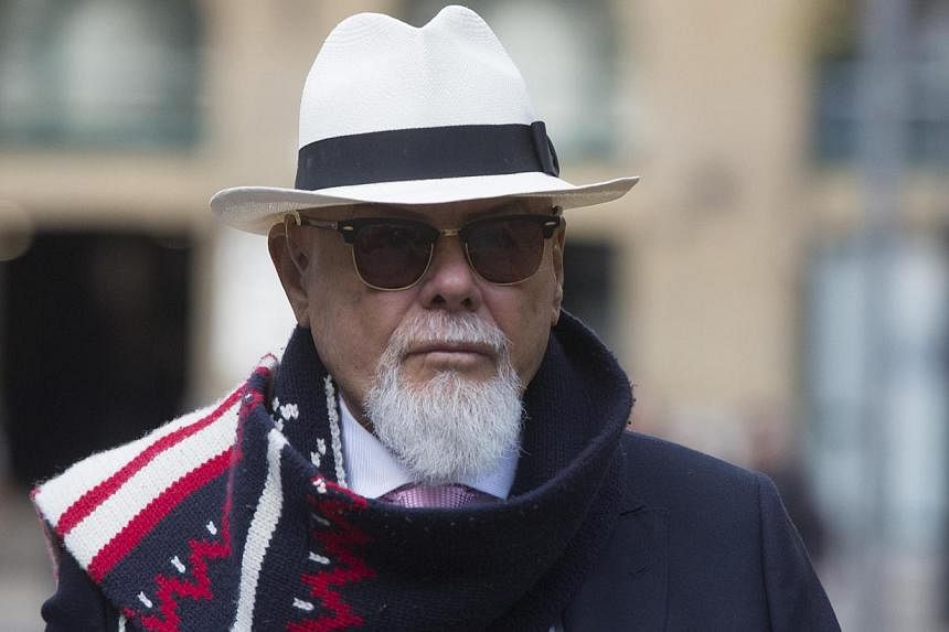 Gary Glitter, whose real name is Paul Gadd, arrives at Southwark Crown Court in London on Nov 11, 2014. The former British pop star denied a string of sex offences against three underage girls as he appeared in a London court Tuesday and will face tr