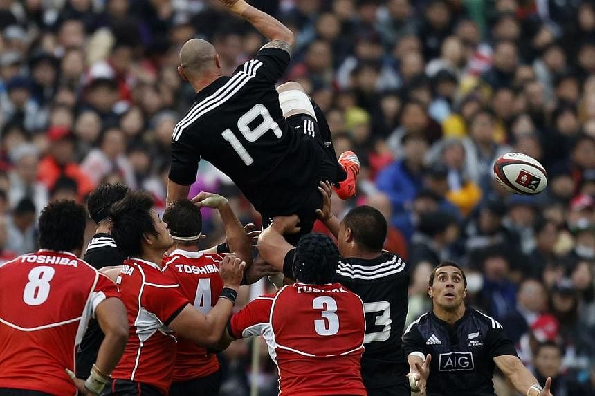 Japan's national rugby team (in red) taking on the New Zealand All Blacks in a test match in Tokyo on Nov 8. Japan have risen two places to an all-time high of ninth in the rugby world rankings after an impressive streak of 10 Test match victories, b
