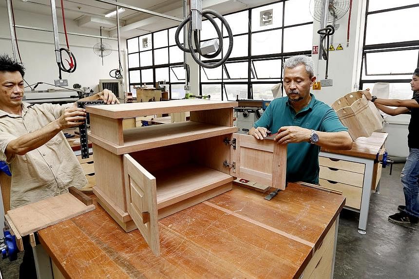 Aspiring carpenters now have a new training ground, as the furniture industry's first carpentry training centre was officially opened on Tuesday. -- ST PHOTO: LAU FOOK KONG