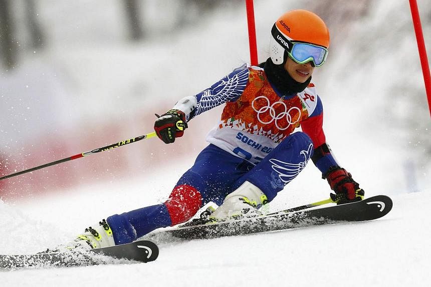 Pop violinist Vanessa Mae has been banned by the International Ski Federation (FIS) for four years over the manipulation of giant slalom races which allowed her to qualify for the Sochi Olympic Games. -- PHOTO: REUTERS