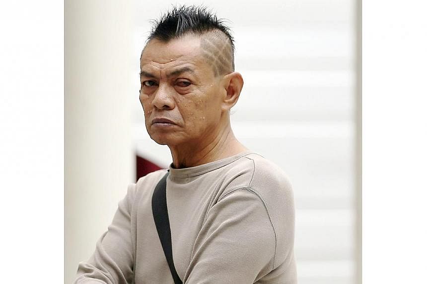 Abdul Rahman Ibrahim, 64, has been accused for using a mini samurai sword to slash Yun Yew Lee, on his left forearm and his back. -- ST PHOTO: WONG KWAI CHOW