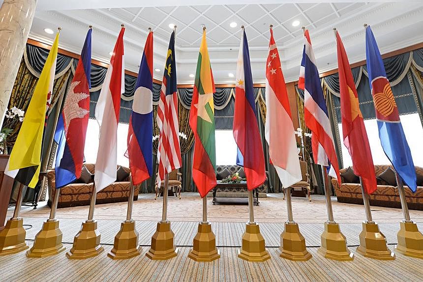 The Asean flag as well as flags of Asean member states on display at the Prime Minister's Office Building Complex in Bandar Seri Begawan, Brunei. -- PHOTO: BT FILE