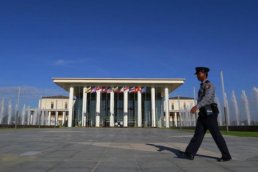 &nbsp;A policeman walking in front of the Myanmar International Convention Centre during the 25th Asean Summit in Naypyitaw on November 12, 2014. -- PHOTO: REUTERS