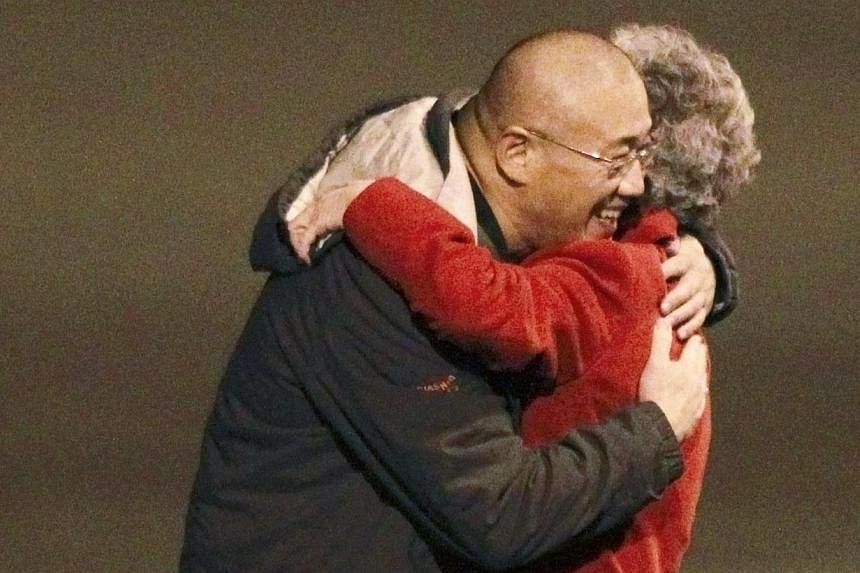 Kenneth Bae and his mother Myung Hee Bae embrace as they reunite after he landed aboard a US Air Force jet at McChord Field at Joint Base Lewis-McChord, Washington Nov 8, 2014 following his release from North Korea.&nbsp;Christian groups in North Kor