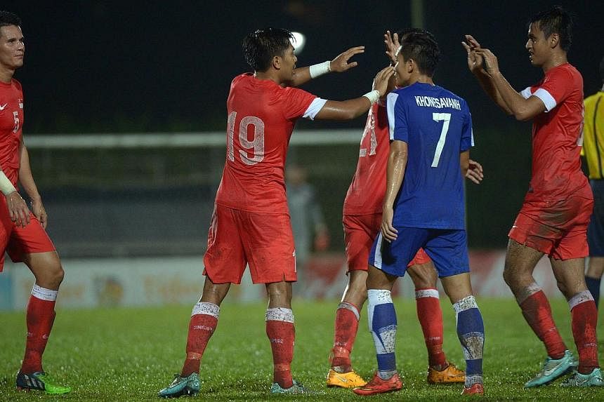 With just one win this year, the Singapore national football team needed a morale booster and Bernd Stange's men got that by beating Laos 2-0 in an international friendly on Thursday evening. -- ST PHOTO: DESMOND WEE