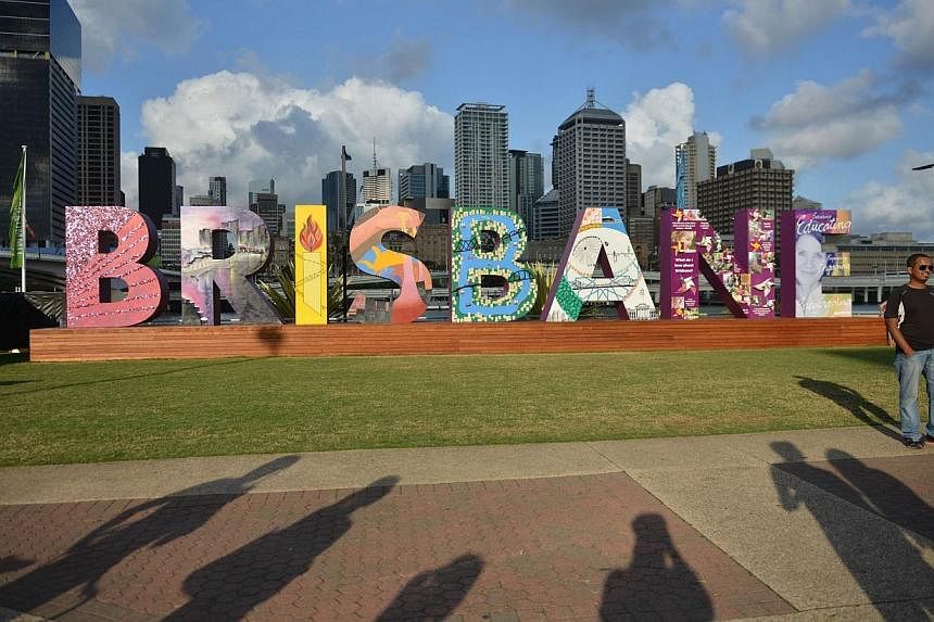 A visitor poses for photos in front of a "Brisbane" artwork along the Brisbane River bank on Nov 13, 2014, ahead of the G20 Summit.&nbsp;&nbsp;Prime Minister Lee Hsien Loong will be in Brisbane, Australia, on Saturday and Sunday for the Group of 20 (