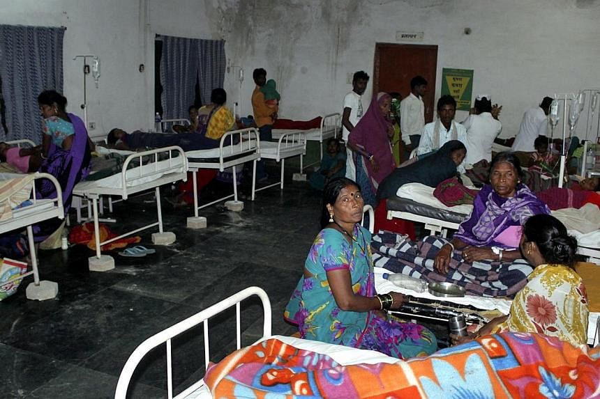 Women who underwent botched sterilization surgeries at a government mass sterilization "camp" receive treatment at a district hospital in Bilaspur, in the eastern Indian state of Chhattisgarh on Nov 10, 2014.&nbsp;The doctor whose sterilisation of 83