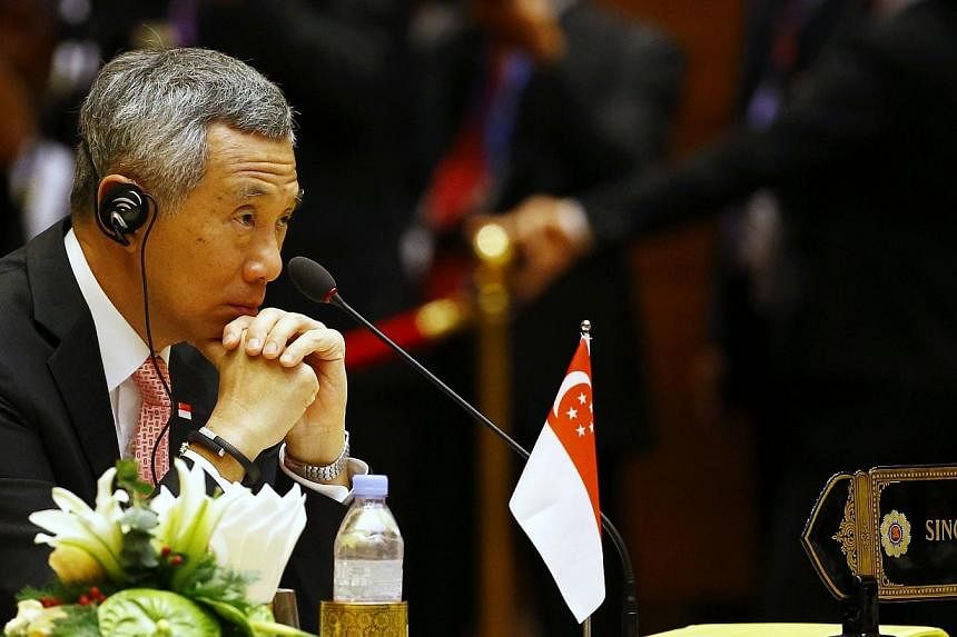 Singapore's Prime Minister Lee Hsien Loong listens to the speech during the plenary session of the 25th ASEAN summit at Myanmar International Convention Centre in Naypyitaw on Nov 12, 2014. -- PHOTO: REUTERS