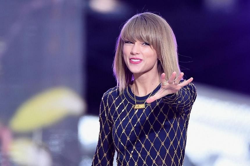 Taylor Swift Performs On ABC's "Good Morning America" at Times Square on Oct 30, 2014, in New York City.&nbsp;Taylor Swift says Spotify does not pay singers and songwriters fairly. Spotify says it has paid them US$2 billion (S$2.6 billion) and a star