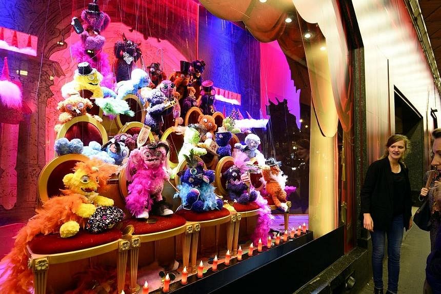 A Monster show is presented in a christmas animated shop window of the Galeries Lafayette department store on Nov 5, 2014, in Paris. -- PHOTO: AFP