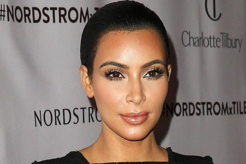 Television personality Kim Kardashian attends Charlotte Tilbury's 'Make-up Your Destiny' beauty festival at Nordstrom at the Grove in Los Angeles, California on Oct 9, 2014. -- PHOTO: AFP